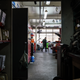 An auto mechanic walks through a repair shop on January 13, 2022 in Louisville, Kentucky.